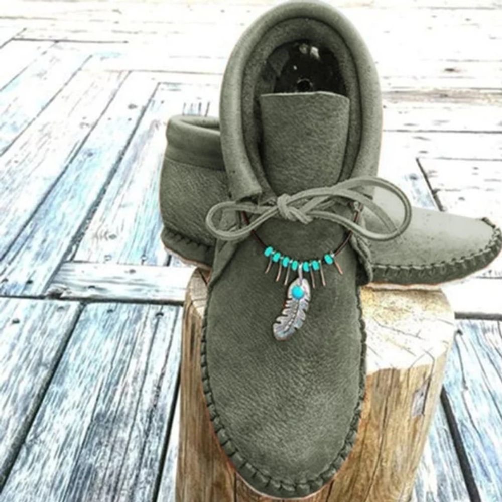 Mocassins indiens montants avec plumes décoratives