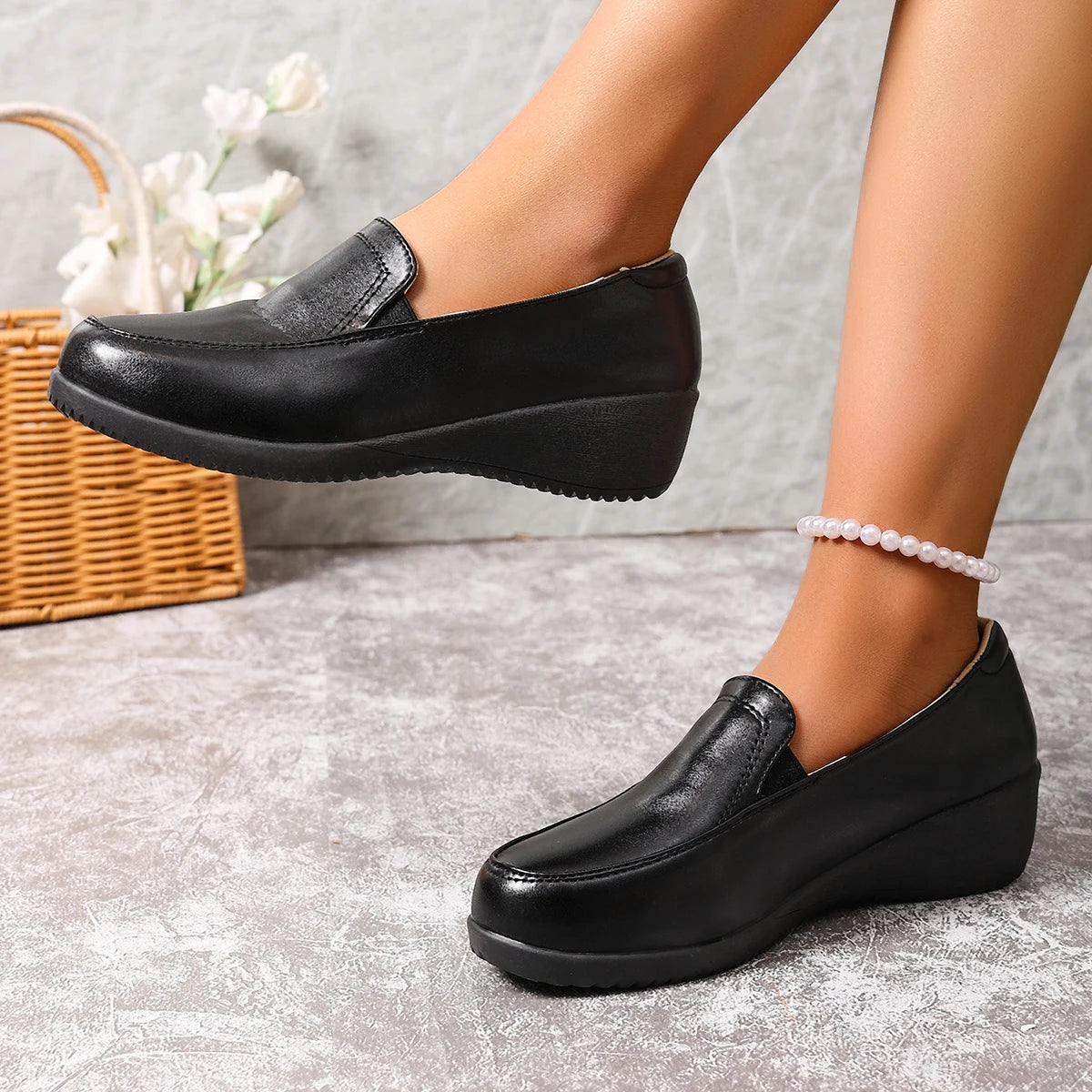 Mocassins compensés noirs pour femme