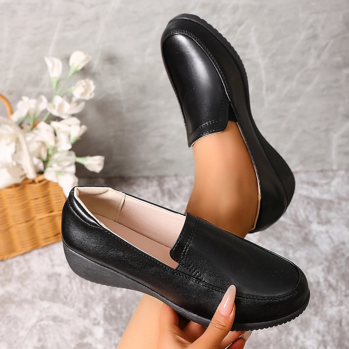 Mocassins compensés noirs pour femme