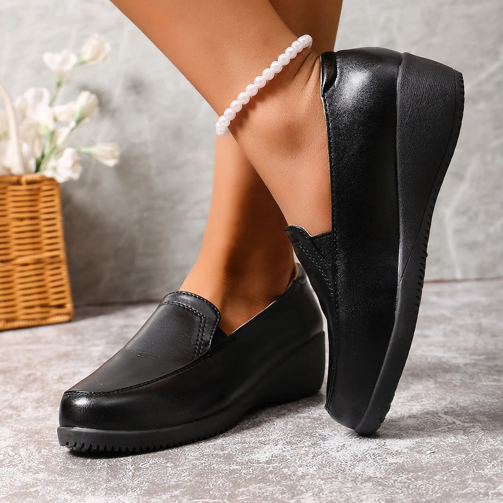 Mocassins compensés noirs pour femme