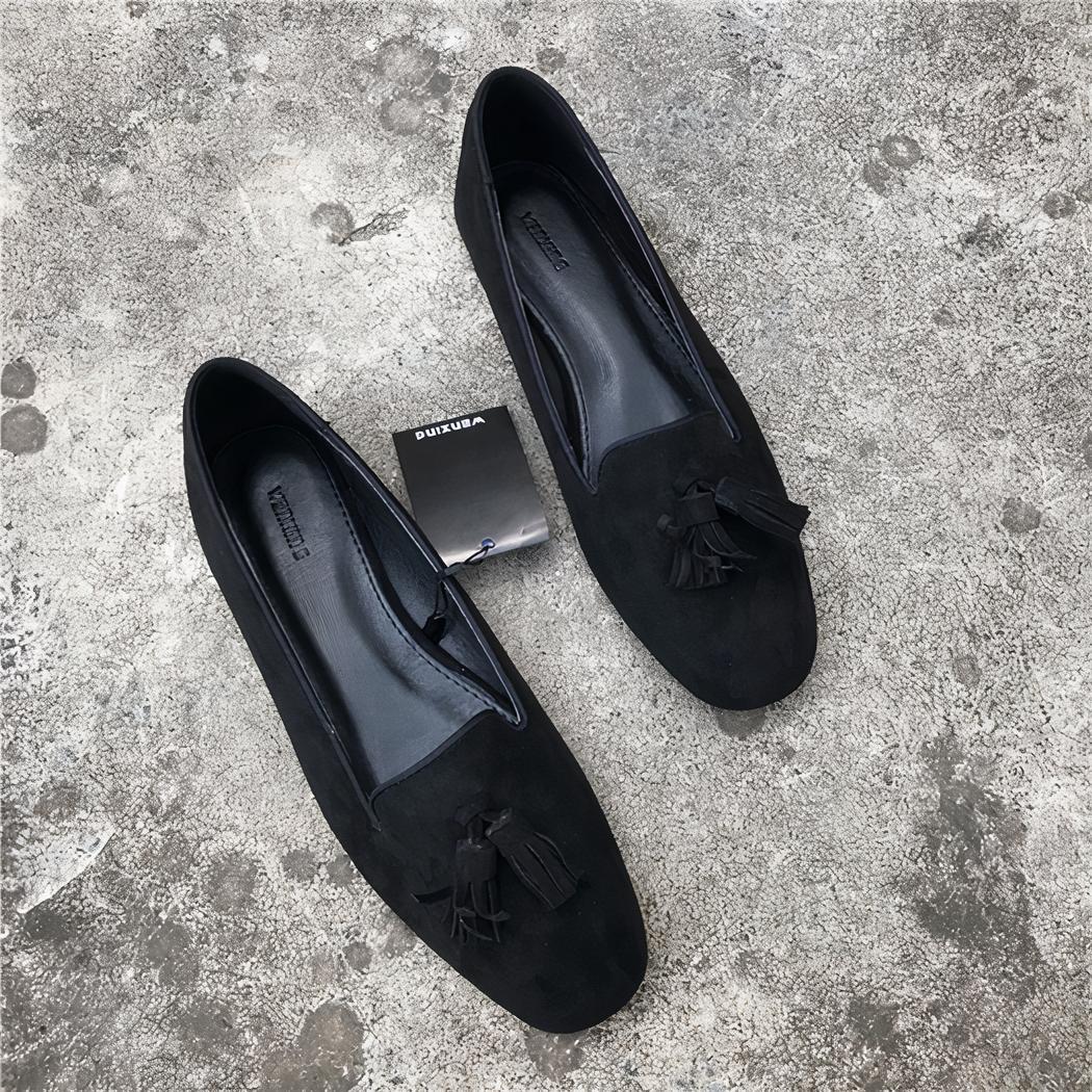 Mocassins à glands noirs effet daim pour femme