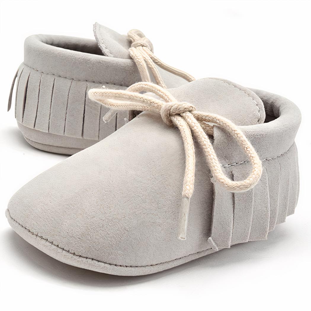 Mocassins à lacets avec des franges pour bébé