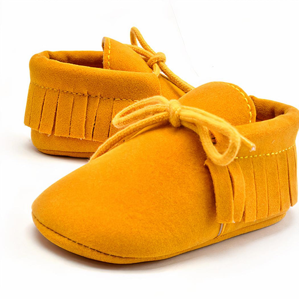 Mocassins à lacets avec des franges pour bébé
