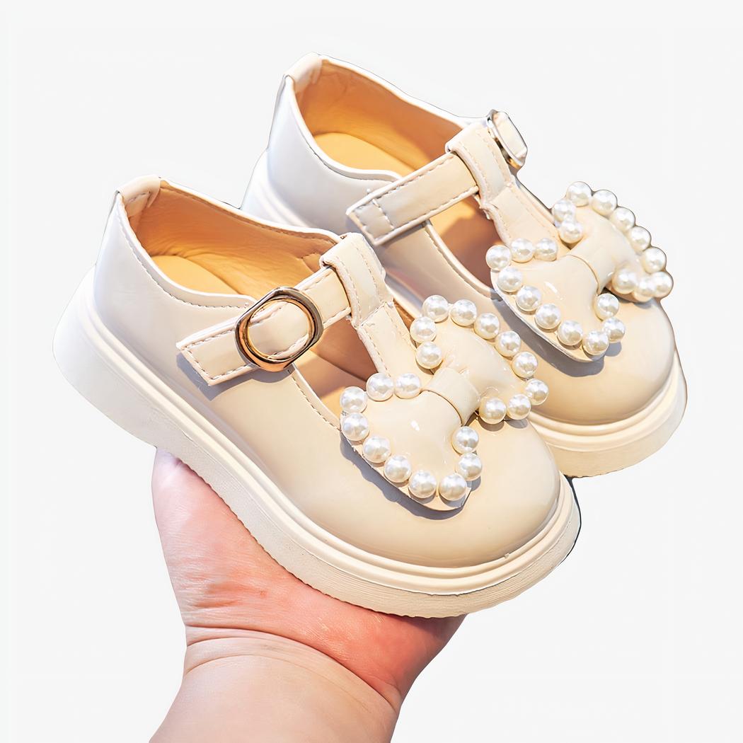 mocassin en PU blanc pour bébé avec un noeud sur le dessus ainsi que des perles