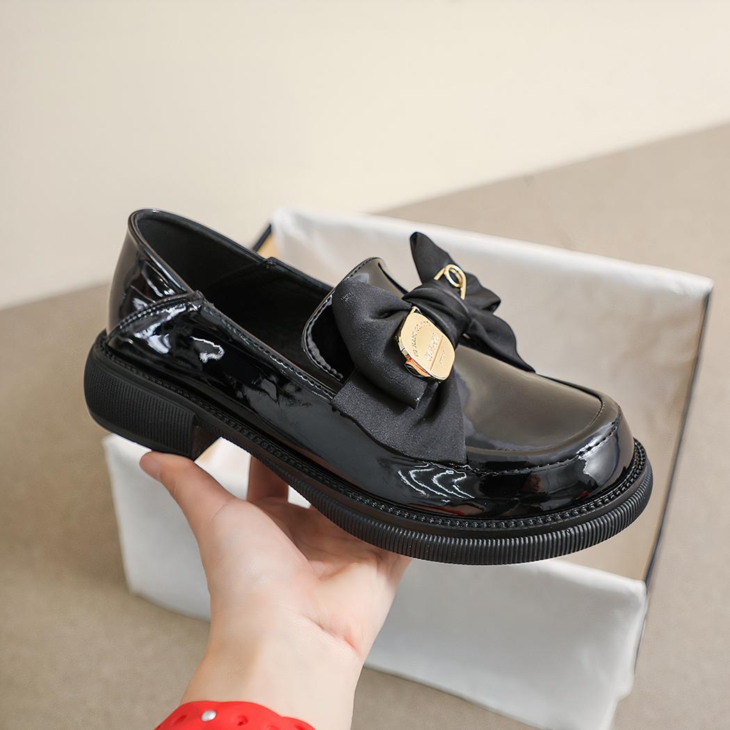 Mocassins noirs style britannique avec un nœud de papillon pour femmes