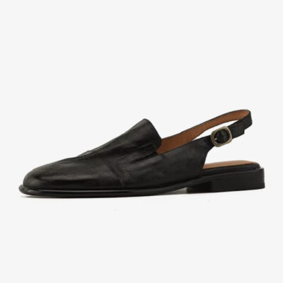 Photo d'un mocassin mule noir en cuir type sandale pour femme vu de profil
